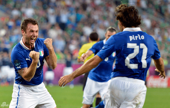  Antonio Cassano and Andrea Pirlo celebrate Italy's first goal.