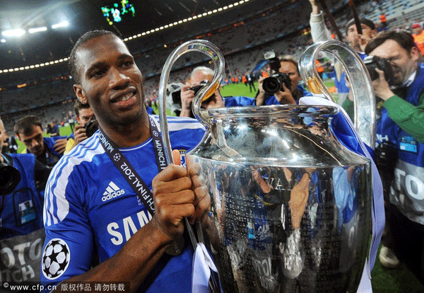 A file picture dated 19 May 2012 shows Chelsea's Didier Drogba celebrating with the trophy after the team won the UEFA Champions League final between FC Bayern Munich and Chelsea FC in Munich, Germany. 