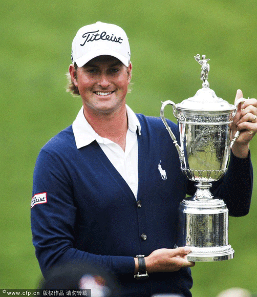 Webb Simpson savours success as he poses with the championship trophy at the US Open in San Francisco.