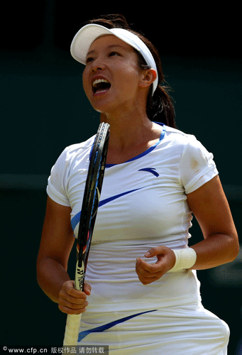 Jie Zheng of China reacts during her Ladies' Singles third round match against Serena Williams of the USA on day six of the Wimbledon Lawn Tennis Championships at the All England Lawn Tennis and Croquet Club at Wimbledon on June 30, 2012 in London, England. 