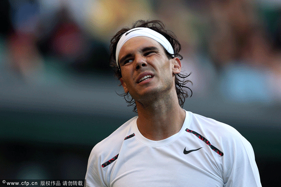 Rafael Nadal of Spain reacts during his second round match against Lukas Rosol of the Czech Republic on day four of the Wimbledon Lawn Tennis Championships at the All England Lawn Tennis and Croquet Club on June 28, 2012 in London, England.