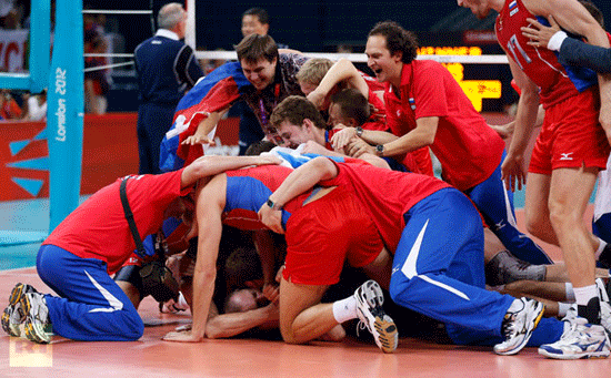 Russia players celebrate after beating Brazil in men's volleyball final.