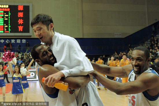 Gilbert Arenas and D.J. White celebrated with Liu Wei after Shanghai's victory over Shanxi in a CBA game on Jan.15, 2013.