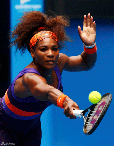  Serena Williams of USA returns a ball to Edina Gallovits-Hall.