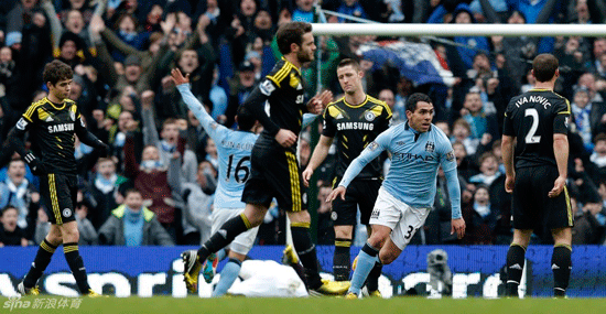 Manchester City's Carlos Tevez (second right) celebrates after scoring the second goal during their English Premier League match against Chelsea at the Etihad Stadium in Manchester, northern England, yesterday. City won 2-0.  