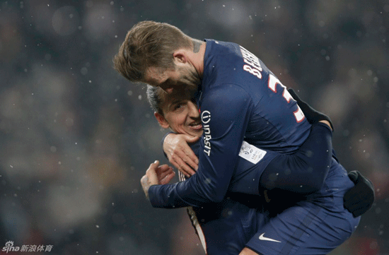 David Beckham celebrates with goal-scorer Zlatan Ibrahimovic after Paris Saint-Germain took a two-goal lead.