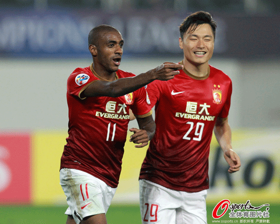  Guangzhou Evergrande's Muriqui celebrates with teammate Gao Lin after scoring the second goal for his team against Urawa Red Diamonds in AFC Champions League opener.