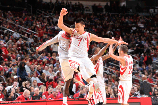Jeremy Lin celebrates with teammates in Rockets 136-102 win over Dallas Mavericks on March 4, 2013.