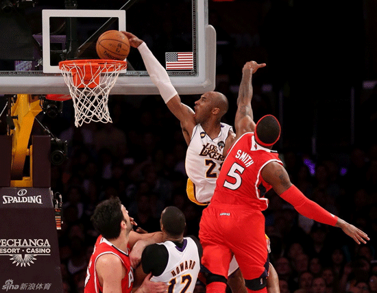 Kobe Bryant slams dunk in the face of Josh Smith in Lakers win over Hakws on March 4, 2013.