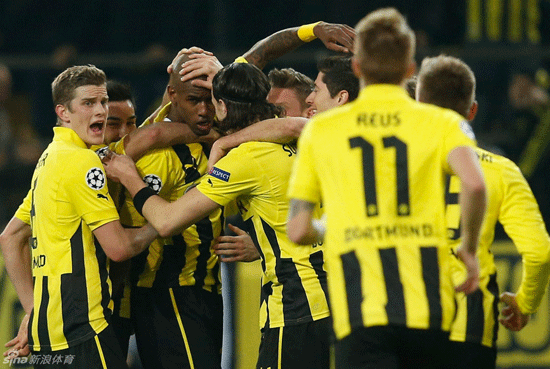 Dortmund players celebrate goal in their team's 3-0 win over Shakhtar Donetsk in the second leg of last-16 matchup of UEFA Champions League at outsold Westfalenstadion on March 5, 2013.