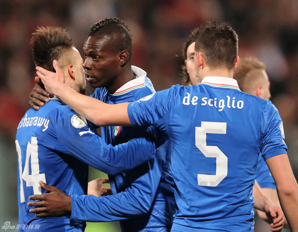 Mario Balotelli celebrates with teammates.