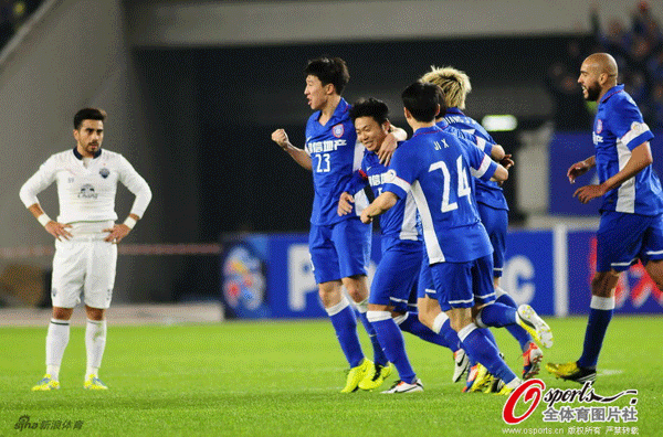  Jiangsu Sainty players celebrate after Lu Bofei scored the opener against Buriram United in a AFC Champions League group E match in Nanjing, Jiangsu on April 2, 2013.