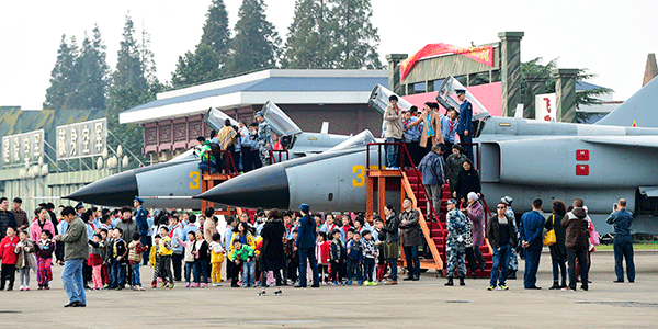 Residents visit a PLA Air Force base in Hangzhou, Zhejiang province, during an open day on Wednesday marking the force's 66th anniversary. Li Zhong / for China Daily