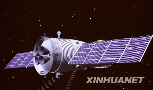 神舟七号载人飞船在太空遨游的模拟图（9月27日10时06分44秒摄于北京航天飞行控制中心）。 