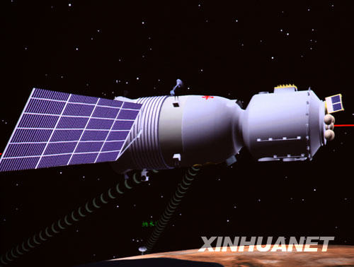 神舟七号载人飞船在太空遨游的模拟图（9月27日10时10分14秒摄于北京航天飞行控制中心）。 