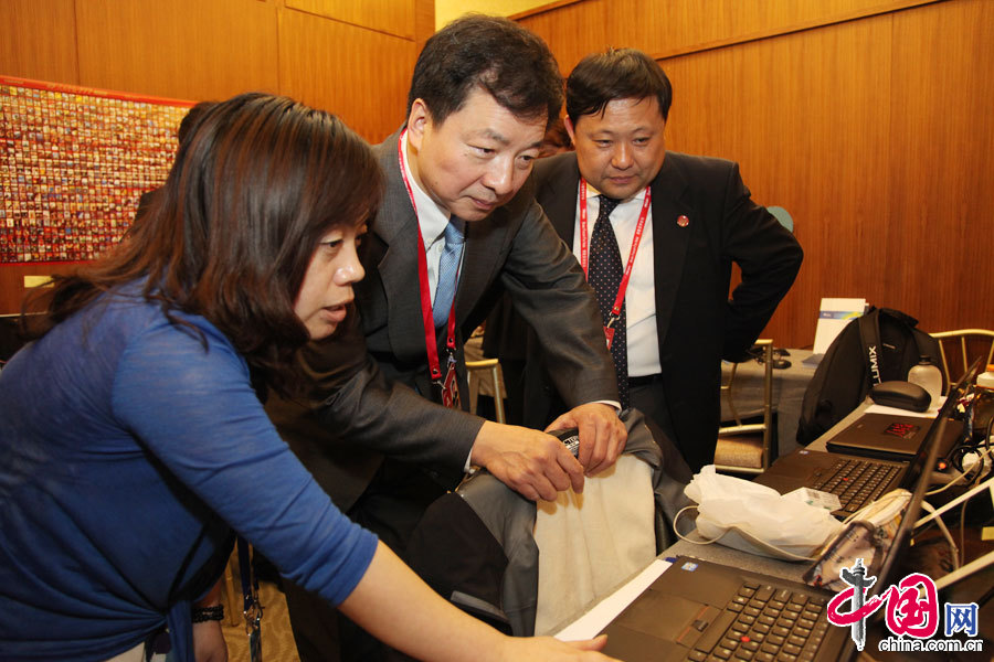 中国外文局局长周明伟出席博鳌亚洲论坛2013