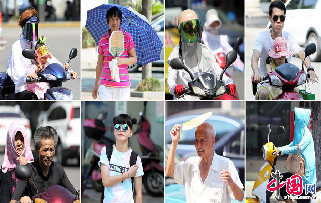 2013年7月29日，气温达到39.3℃，是浙江省嘉善县今年以来的最高气温，高温下街头行人各式装扮的面孔显现。中国网图片库 胡凌翔摄影