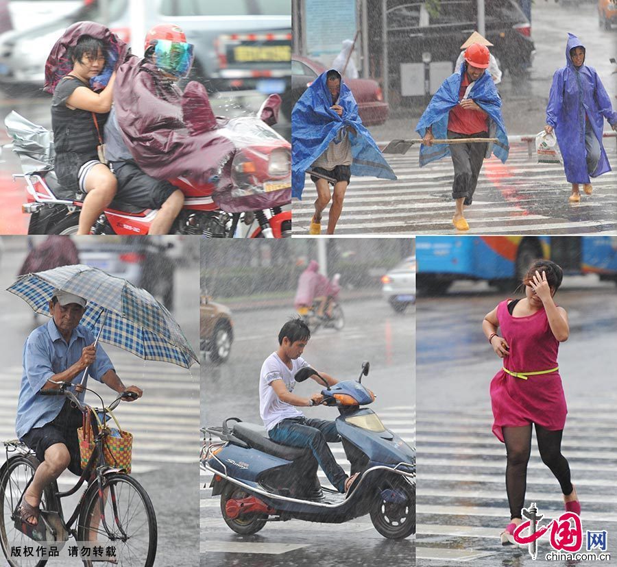 圖為2013年8月2日，受“飛燕”影響，海南瓊海市民頂風冒雨出行。 中國網圖片庫 蒙鐘德/攝