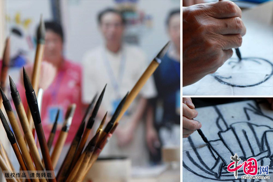 扑灰年画技法独特，以色代墨，线条豪放流畅，写意味浓，格调明快。中国网图片库 王海滨/摄
