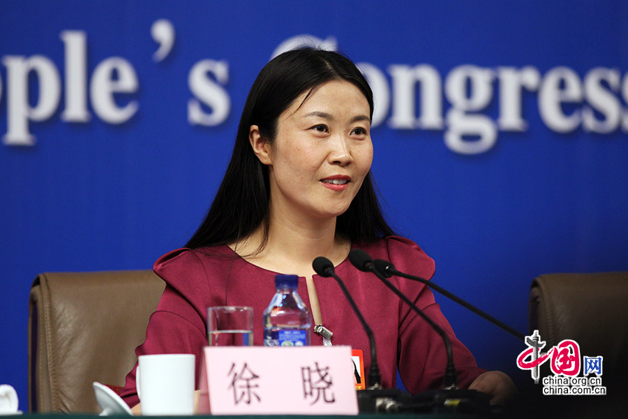 3月12日，全国人大代表、河南省开封城摞城发展有限公司董事长徐晓回答记者提问。