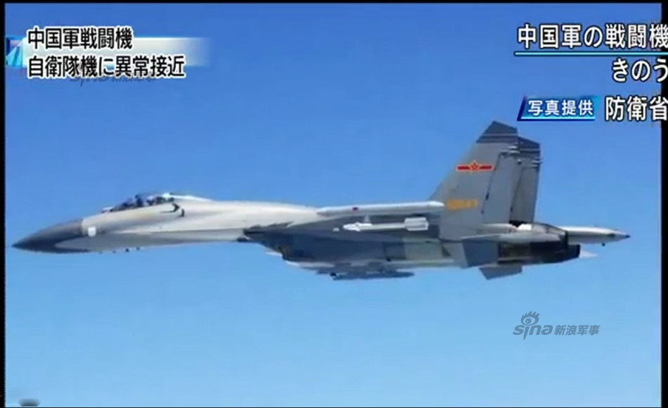 中国挂弹苏-27接近自卫队侦察机 日本公开清晰照