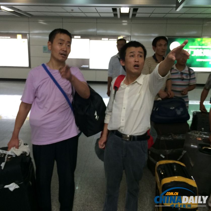 首批8名从伊拉克撤回中国工人回到广州