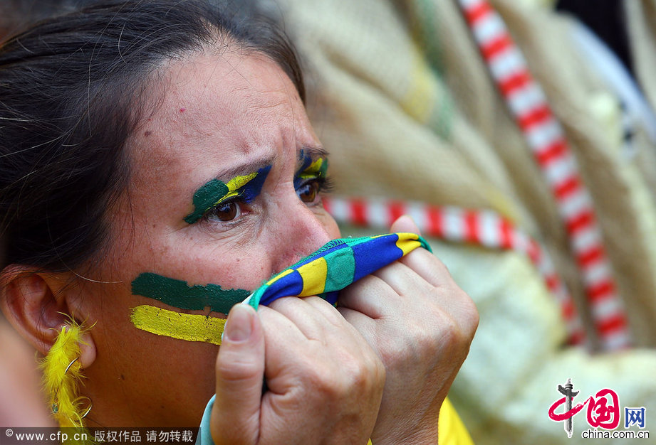 2014年7月8日，巴西米内罗竞技场，2014巴西世界杯半决赛，巴西Vs德国。各地巴西球迷观战痛哭流涕。图片来源：cfp