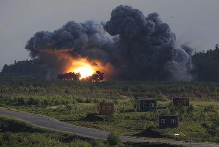 A rocket explodes on target during the opening of the Army-2015 international military forum in Kubinka