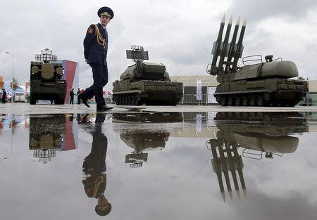 Russian serviceman walks past Buk-1M missile system at Army-2015 international military forum in Kubinka