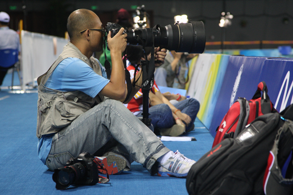 Les journalistes de China.org.cn photographient les Jeux olympiques. 