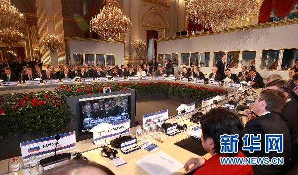 Ouverture du 8e sommet de l'ASEM, dominé par la gouvernance financière et économique