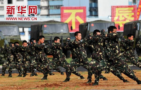 Le 29 juin, des réservistes de la province du Hainan font une démonstration de leurs compétences. 