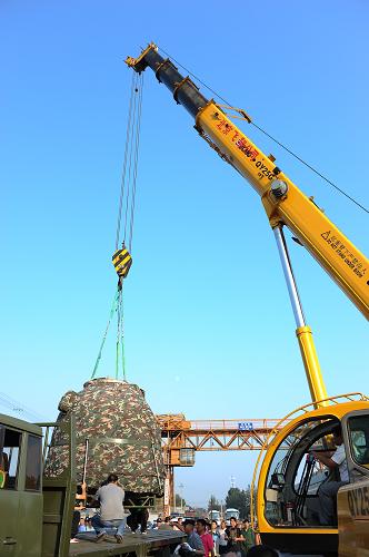 La capsule de retour de Shenzhou-9 transportée à Beijing