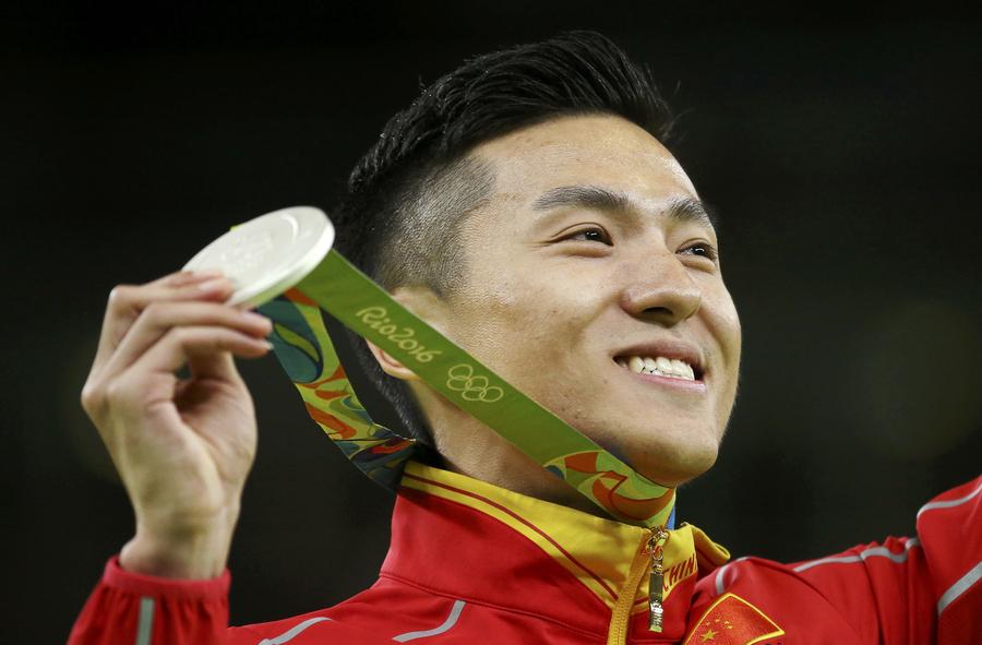 Le Chinois Dong Dong, champion olympique en titre, a remporté la médaille d&apos;argent avec 60,535 points à Rio de Janeiro, au Brésil, le 13 août 2016. [Photo Wei Xiaohao / chinadaily.com.cn]