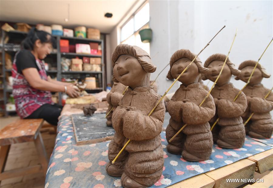 La sculpture sur argile Sanchizhai, dans le nord de la Chine