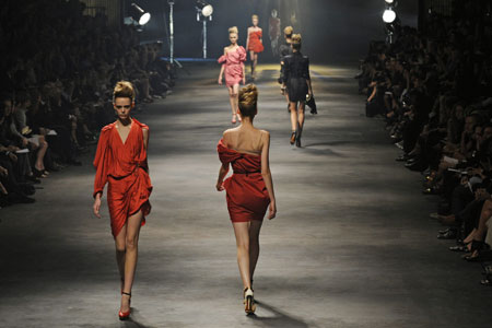 Models present creations by designer Alber Elbaz for French fashion house Lanvin as part of his Spring/Summer 2010 collection during Paris Fashion Week October 2, 2009.