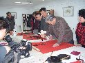 Die Jahrmärkte sind eine besondere historische Attraktion geworden und spielen bei der Verbreitung der traditionellen chinesischen Volkskultur eine wichtige Rolle. (Kaligraphie-Show)