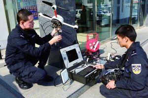 Two police officers test the F6A EOD robot. (Photo: Beijing Morning Post)