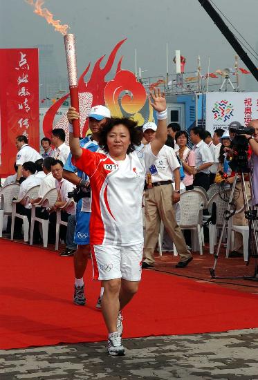 21 июля: В Циндао завершился очередной этап эстафеты огня Пекинской Олимпиады