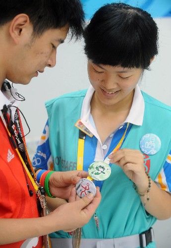 Значки Олимпийских волонтеров