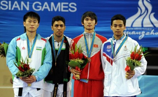 Дмитрий Ким из Узбекистана занял второе место в соревновании по тхэквондо в весовой категории до 74 кг. на Азиатских играх в Гуанчжоу 2