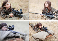 Симпатичная пятилетняя девочка, вооруженная снайперской винтовкой