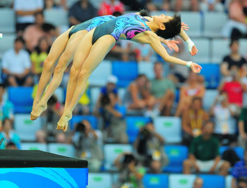 Clavadistas chinas ganan oro en salto sincronizado desde plataforma de 10 metros 5