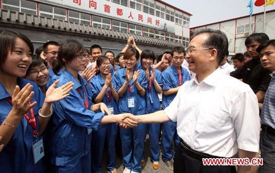 Primer ministro chino pide mejorar condiciones de vida de trabajadores migrantes en ciudades3