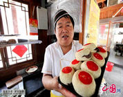 Platos famosos de Tianjin: “El sapo que escupe miel”