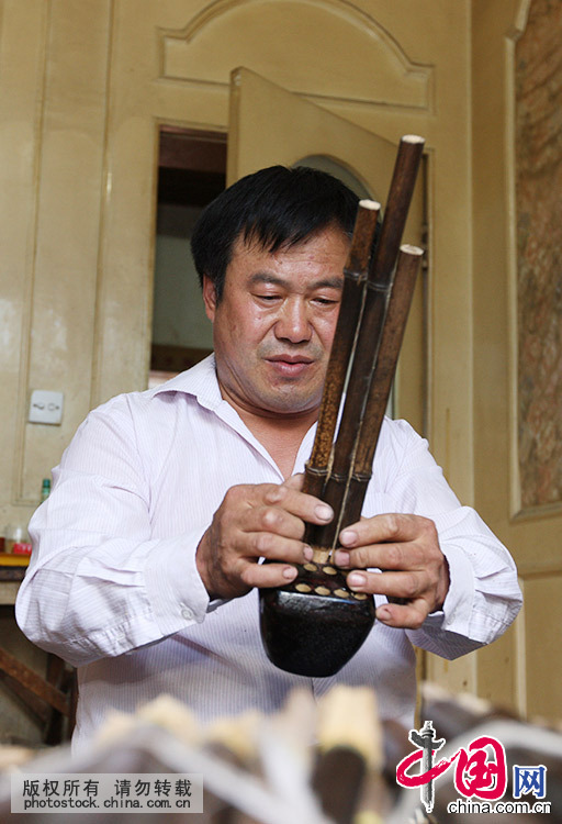 Enciclopedia de la cultura china: La producción a mano del instumento musical sheng 4