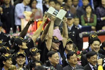 Zhu Fangyu of Guangdong Hongyuan holds up the trophy after the fifth match of the Chinese Basketball Association (CBA) finals against Liaoning Panpan in Dongguan, a city of south China's Guangdong Province, Feb. 22, 2008. Guangdong Hongyuan beat Liaoning Panpan with 90-81 in the fifth match on Friday and won the champion. 