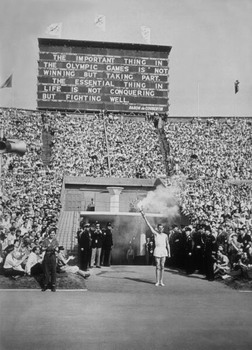 The Torch Bearer, the last of the runners bringing the flame from Greece, arrives at Wembley Stadium, London, during the opening ceremony of the 1948 London Olympic Games.