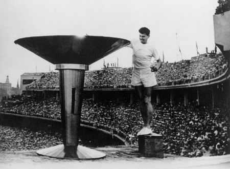 Ron Clarke of Australia lights the Olympic Torch at the opening ceremony of the 17th Olympic Games held in Melbourne, November 26, 1956.
