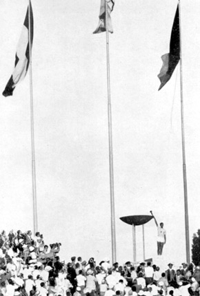 The Italian athlete lights the Olympic Flame with a torch at the opening ceremony for the Olympic Games in Rome, 1960.